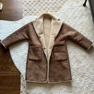Reversible faux shearling-lined coat By Mango